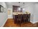 Basement wet bar with granite countertop and seating at 3012 Wheatfield Dr, Waxhaw, NC 28173
