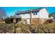 Backyard view with a deck, brick foundation, walkout basement, satellite dish, and a cozy outdoor space at 2725 Carla Dr, Shelby, NC 28150