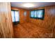 Bedroom featuring carpet, wood paneled walls and a view from the entry hallway at 2725 Carla Dr, Shelby, NC 28150