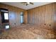 Bedroom featuring wood paneling, carpet and an open closet at 2725 Carla Dr, Shelby, NC 28150