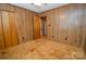 Cozy bedroom with wood paneling and plush carpeting, offering a warm and inviting atmosphere at 2725 Carla Dr, Shelby, NC 28150