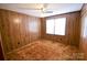 Bedroom with wood-paneled walls, ceiling fan and carpet at 2725 Carla Dr, Shelby, NC 28150