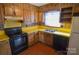 Efficient kitchen featuring wood cabinets, yellow countertops, and standard appliances at 2725 Carla Dr, Shelby, NC 28150