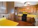 Functional kitchen with wood cabinets, unique yellow countertops, and essential appliances at 2725 Carla Dr, Shelby, NC 28150