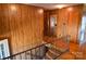 Staircase with wood paneled walls leading to an upper level with hardwood floors at 2725 Carla Dr, Shelby, NC 28150