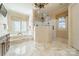 Luxurious bathroom with a large soaking tub, walk-in shower, and marble flooring at 300 Eagle Bend Dr, Waxhaw, NC 28173