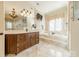 Elegant bathroom features a double vanity, soaking tub, and a walk-in shower at 300 Eagle Bend Dr, Waxhaw, NC 28173