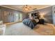 Comfortable bedroom with plush carpet and private balcony at 300 Eagle Bend Dr, Waxhaw, NC 28173