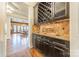 Butlers pantry with wine rack, granite countertop, and dark wood cabinets at 300 Eagle Bend Dr, Waxhaw, NC 28173