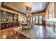 Formal dining room with hardwood floors, built-in hutch, and access to outdoor patio at 300 Eagle Bend Dr, Waxhaw, NC 28173