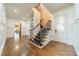 Grand entryway with hardwood floors, a sweeping staircase, and elegant millwork at 300 Eagle Bend Dr, Waxhaw, NC 28173