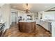 Gourmet kitchen with a large octagonal island and high-end finishes at 300 Eagle Bend Dr, Waxhaw, NC 28173