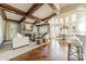 Spacious living room with hardwood floors, a stone fireplace, and high wood-beam ceilings at 300 Eagle Bend Dr, Waxhaw, NC 28173