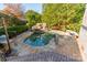 Inviting kidney-shaped pool with stone coping and waterfall feature at 300 Eagle Bend Dr, Waxhaw, NC 28173