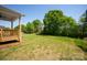 Spacious backyard with lush green grass and mature trees, perfect for outdoor activities and relaxation at 4684 Hopsack Dr # Cal0105, Indian Trail, NC 28079