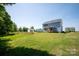Spacious backyard with a covered deck on a charming blue home at 4684 Hopsack Dr # Cal0105, Indian Trail, NC 28079