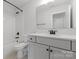 Bright bathroom with white tiled shower and dark fixtures at 4684 Hopsack Dr # Cal0105, Indian Trail, NC 28079