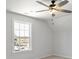 Bright bedroom featuring a ceiling fan and natural light streaming through a window at 4684 Hopsack Dr # Cal0105, Indian Trail, NC 28079