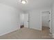 A bright bedroom with neutral carpet and doorways to other areas at 4684 Hopsack Dr # Cal0105, Indian Trail, NC 28079