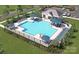 Aerial view of a community pool featuring lounge chairs and shade umbrellas at 4684 Hopsack Dr # Cal0105, Indian Trail, NC 28079