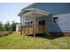 Cozy covered deck with wood railings and a ceiling fan for outdoor relaxation at 4684 Hopsack Dr # Cal0105, Indian Trail, NC 28079