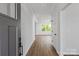 Bright and airy foyer with wood flooring, leading to an open living space filled with natural light at 4684 Hopsack Dr # Cal0105, Indian Trail, NC 28079