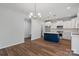 New kitchen with stainless appliances, island with seating, hardwood floors, and modern lighting at 4684 Hopsack Dr # Cal0105, Indian Trail, NC 28079