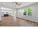 Open-concept living room flows into the kitchen, features hardwood floors and lots of natural light at 4684 Hopsack Dr # Cal0105, Indian Trail, NC 28079