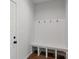 Mudroom entrance features a bench and hooks, offering a practical space for organizing belongings at 4684 Hopsack Dr # Cal0105, Indian Trail, NC 28079