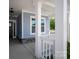 Inviting front porch with white columns and stone accents, offering a welcoming entrance to the home at 4684 Hopsack Dr # Cal0105, Indian Trail, NC 28079