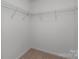 Empty walk-in closet with wire shelving and neutral carpet flooring at 4684 Hopsack Dr # Cal0105, Indian Trail, NC 28079