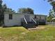 Large back deck with stairs, overlooks a spacious backyard with a picket fence at 6261 Burnhurst Ln, Denver, NC 28037