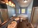 Bright bathroom with a double sink vanity, bathtub, and shower at 6261 Burnhurst Ln, Denver, NC 28037