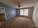 Bright bedroom with plush carpeting, a ceiling fan, and an inviting ambiance at 6261 Burnhurst Ln, Denver, NC 28037