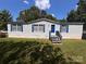 Charming single-story home with blue shutters and a well-maintained lawn at 6261 Burnhurst Ln, Denver, NC 28037