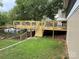 Newly constructed deck with views of the lake, set against a backdrop of mature trees at 193 Marina Dr, New London, NC 28127