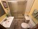 Cozy bathroom featuring tiled floors, vanity, and a shower with sliding glass doors at 193 Marina Dr, New London, NC 28127