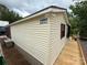 Exterior side view featuring siding, windows, and a convenient wooden ramp at 193 Marina Dr, New London, NC 28127