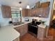 Well-equipped kitchen with stainless steel appliances and ample storage space at 193 Marina Dr, New London, NC 28127