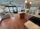 Open-concept living area with kitchen, natural light, and hardwood flooring at 193 Marina Dr, New London, NC 28127