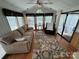 Bright living room with natural light, a neutral sofa, and cozy accents at 193 Marina Dr, New London, NC 28127