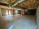 A large unfinished basement with exposed ceiling and concrete floor, offering lots of potential at 2290 9Th Avenue Ne Dr, Hickory, NC 28601