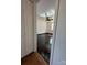 Bedroom entryway showcasing hardwood floors and a ceiling fan, complemented by neutral walls and a window at 2290 9Th Avenue Ne Dr, Hickory, NC 28601