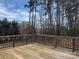 Wooden deck surrounded by trees, offering a serene outdoor retreat at 2290 9Th Avenue Ne Dr, Hickory, NC 28601