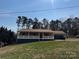 Charming single-story home with a welcoming front porch and attached garage, complemented by a well-manicured lawn at 2290 9Th Avenue Ne Dr, Hickory, NC 28601