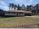 Charming single-story home with a welcoming front porch and attached garage, complemented by a well-manicured lawn at 2290 9Th Avenue Ne Dr, Hickory, NC 28601