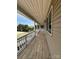 Long, covered front porch showing decorative columns and space for outdoor seating at 2290 9Th Avenue Ne Dr, Hickory, NC 28601