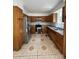 Well-lit kitchen featuring stainless steel appliances, oak cabinetry, and tile flooring at 2290 9Th Avenue Ne Dr, Hickory, NC 28601