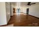 Spacious living room with hardwood floors, ceiling fan, and ample natural light at 2290 9Th Avenue Ne Dr, Hickory, NC 28601