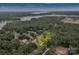 Aerial view of a wooded property near a lake, highlighting its natural beauty and secluded location at 7245 Static Way, Sherrills Ford, NC 28673